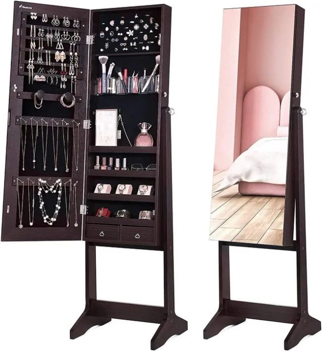 A standing mirror with a hidden interior that reveals jewelry storage