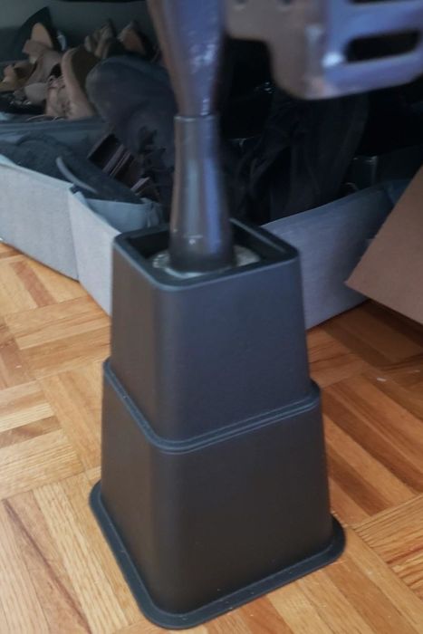 a reviewer's photo of two bed risers stacked vertically