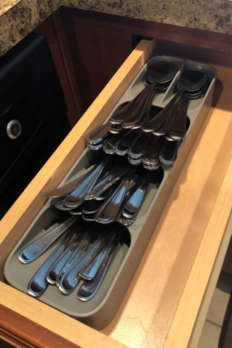 Photo from a reviewer showing a neatly organized drawer with their silverware neatly arranged in the drawer organizer.