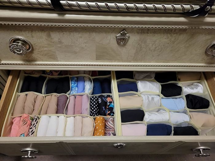 An open drawer neatly arranged with folded socks in various styles and patterns, making selection quick and easy