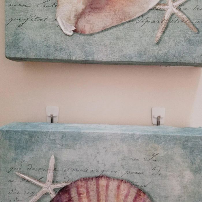 Canvas artwork securely hung by the hooks.