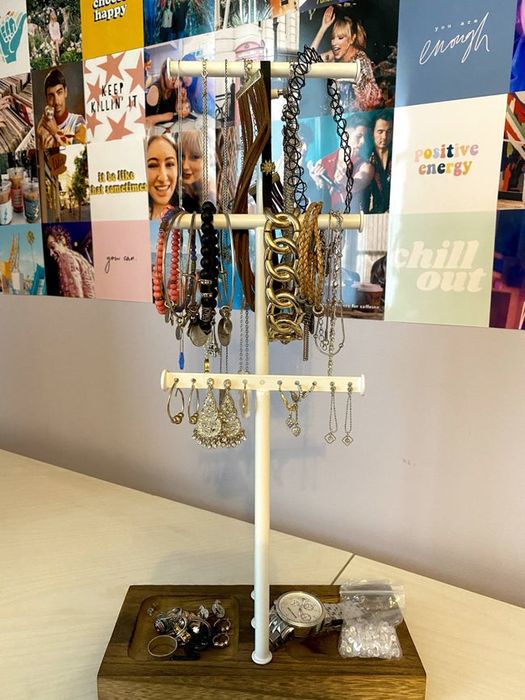 Mytour Editor Samantha Wieder's jewelry tree displaying necklaces, bracelets, and earrings
