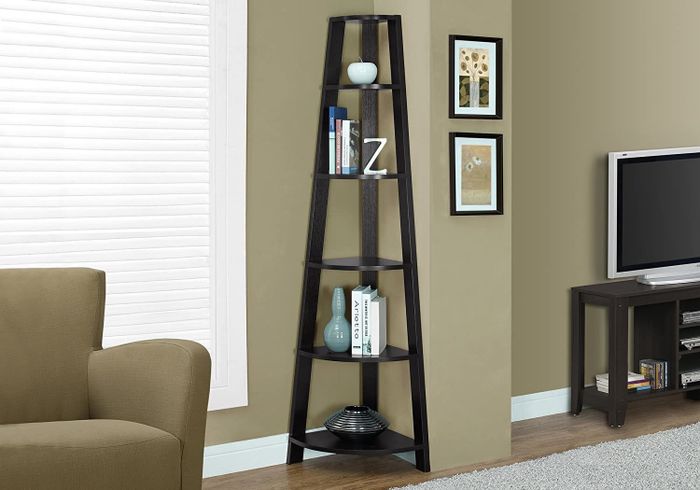 A five-tier corner shelf neatly placed in the corner of a living room
