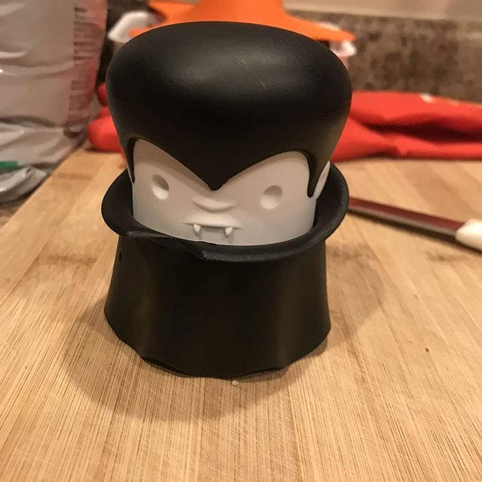 A playful figurine with a vampire theme, showcasing a cheeky and mischievous expression