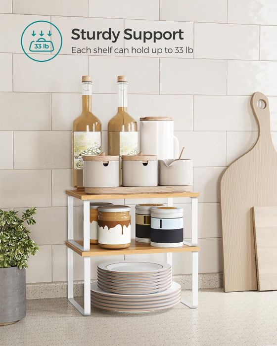 A three-tiered wooden shelf showcasing kitchen items and bottles, with a text overlay detailing its weight capacity.