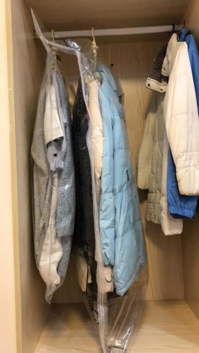 A reviewer’s photo showing their clothes stored inside the vacuum bags