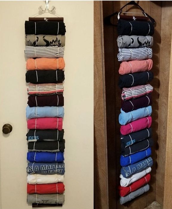 The T-shirt organizer, containing 16 shirts, hanging neatly in a closet