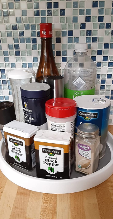 A reviewer’s lazy Susan holding condiments and spices for easy access.