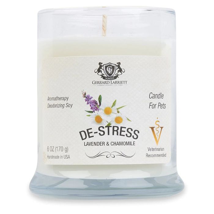 a glass candle labeled 'de-stress'