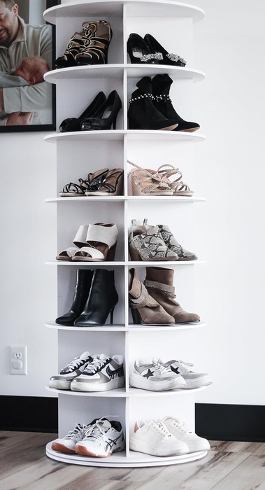 A reviewer's white 7-tier tower holding multiple pairs of shoes in an organized fashion