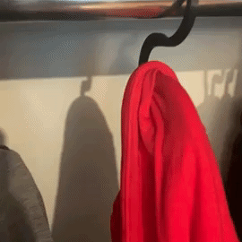 GIF of Mytourer pulling a hoodie off a hanger