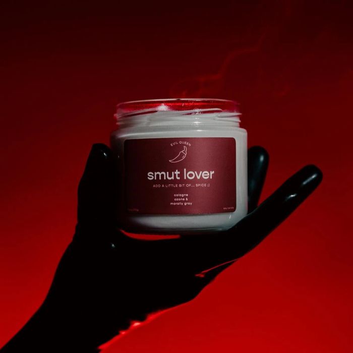 a candle with a deep maroon label that reads 