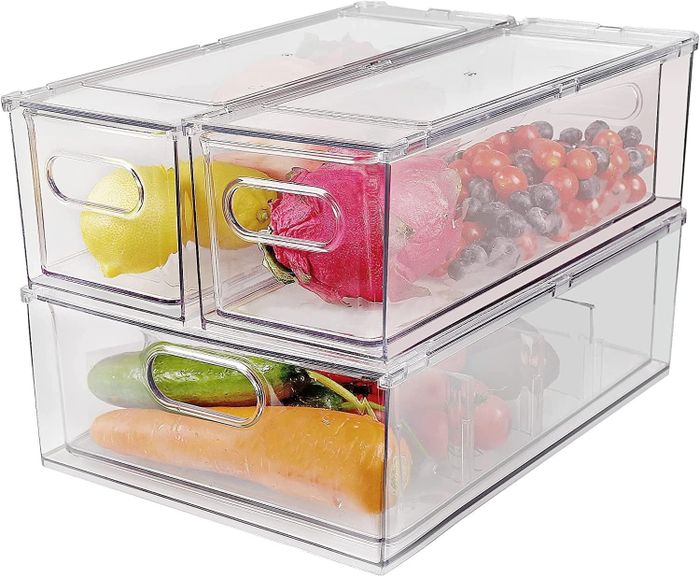 Three transparent bins filled with fresh fruits and vegetables