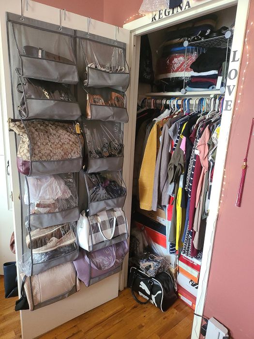 Inside the closet of a reviewer named Sam, showing bags hung on the other side of the door as well