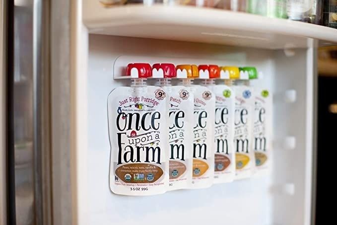 The food pouch organizers attached to the inside door of a fridge