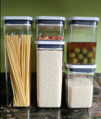 A customer image showing five airtight containers filled with dry and wet goods.