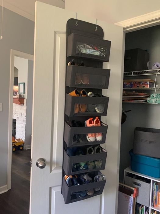 Reviewer’s photo showing the over-the-door rack with shoes inside.