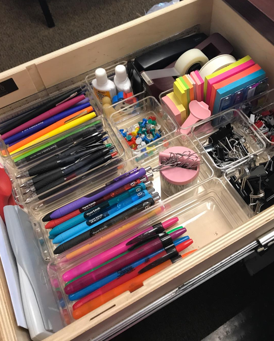 A reviewer's image showing their desk drawer neatly organized with pens, paper clips, and other essentials using the trays.
