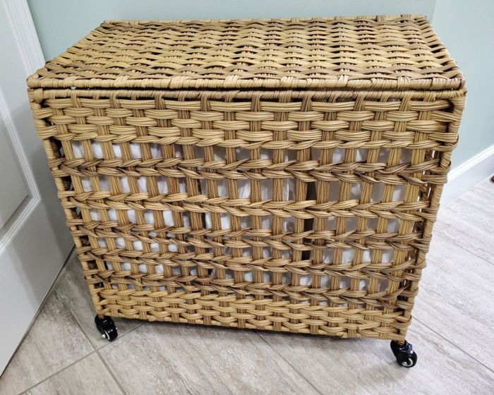 A reviewer's closed, three-section wicker hamper