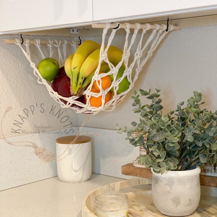 A hanging fruit basket displayed in a kitchen