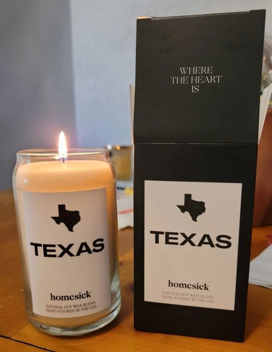a reviewer image of the Texas candle and its packaging