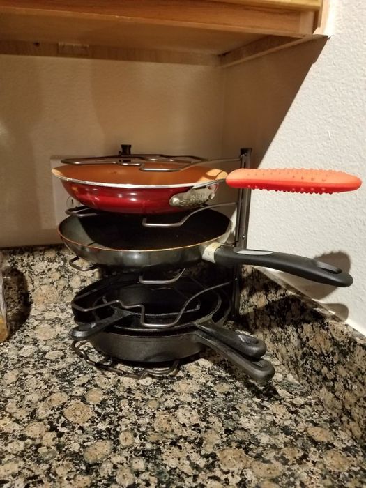 Pans neatly organized in a stacking system