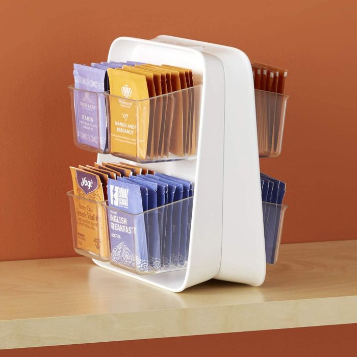 A double-sided organizer neatly filled with an array of tea bags.
