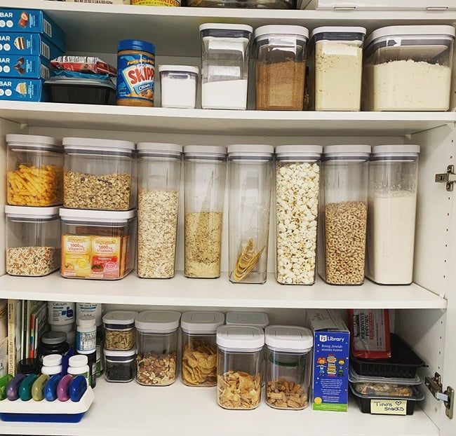 A reviewer's cabinet filled with neatly organized OXO food storage containers