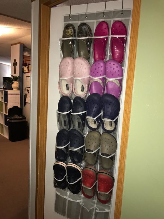 Another reviewer's photo showing shoes neatly arranged in a hanging shoe rack