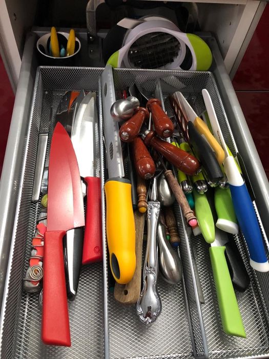 A before photo of a customer's disorganized drawer.
