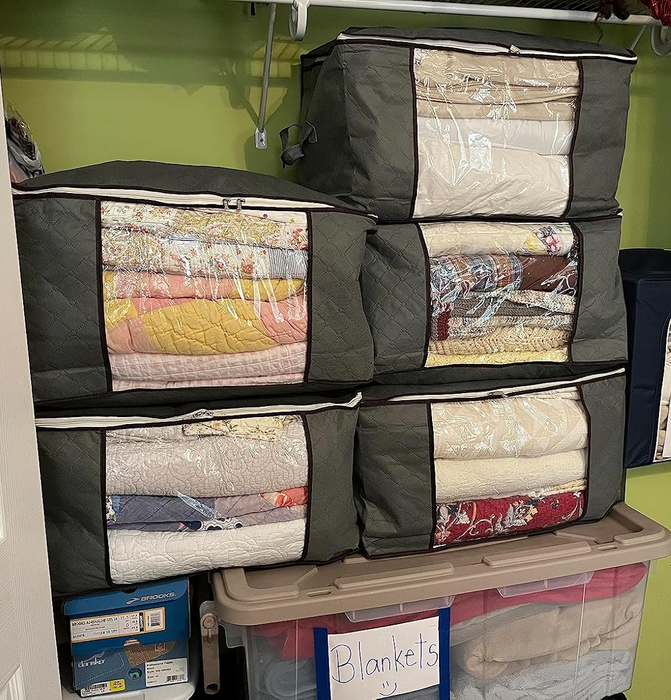 another reviewer's storage cubes neatly packed with items, stored in the closet for easy access and organization