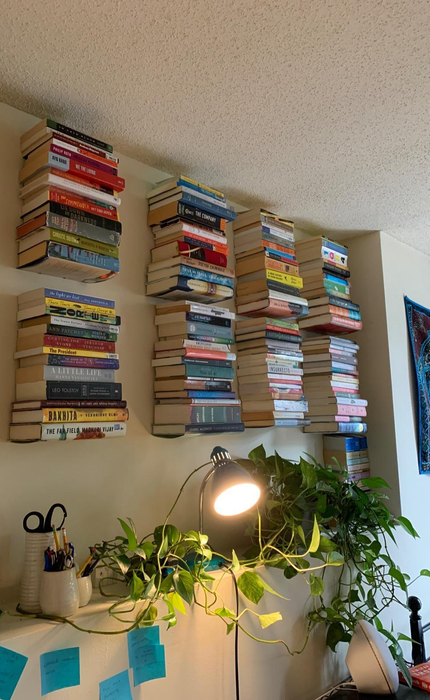 another reviewer uses the floating shelves to create a wall filled with books
