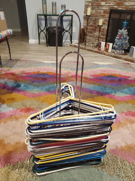 A reviewer's hangers neatly arranged on the stacker.
