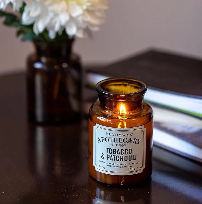 a Paddywax candle infused with the warm scents of tobacco and patchouli