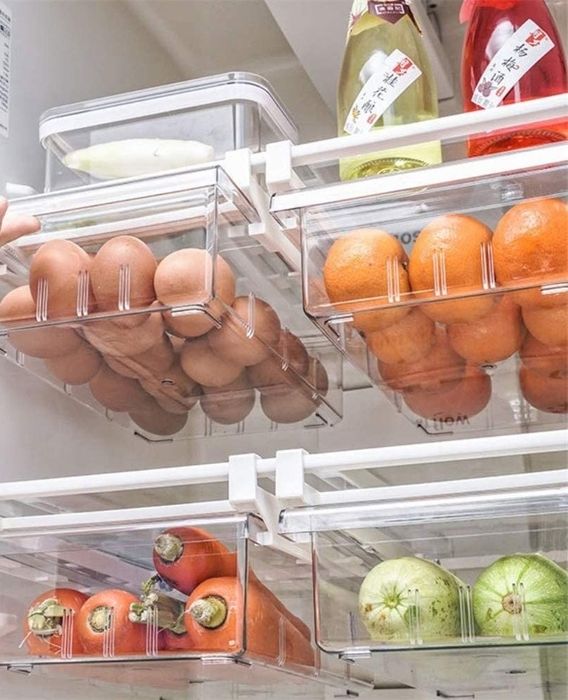 Four drawers attached to fridge shelves, perfectly sized to hold eggs, vegetables, and other perishables.