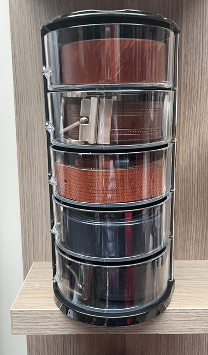 reviewer's acrylic belt organizer neatly holding five belts
