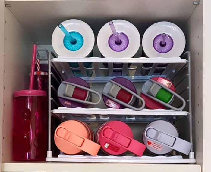 A reviewer’s shelf neatly organized with water bottles.