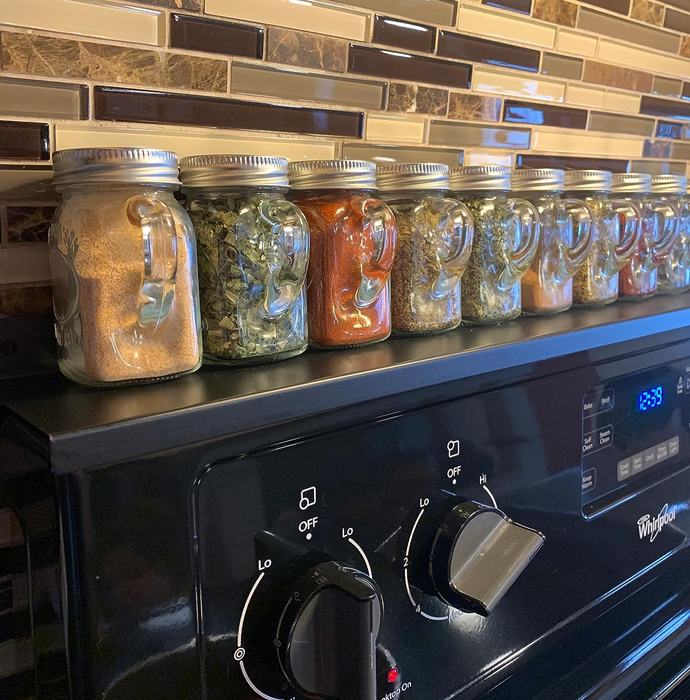 a close-up view of the shelf and the spice jars