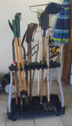 A reviewer’s photo showing the tool rack in action, keeping their garage organized and clutter-free