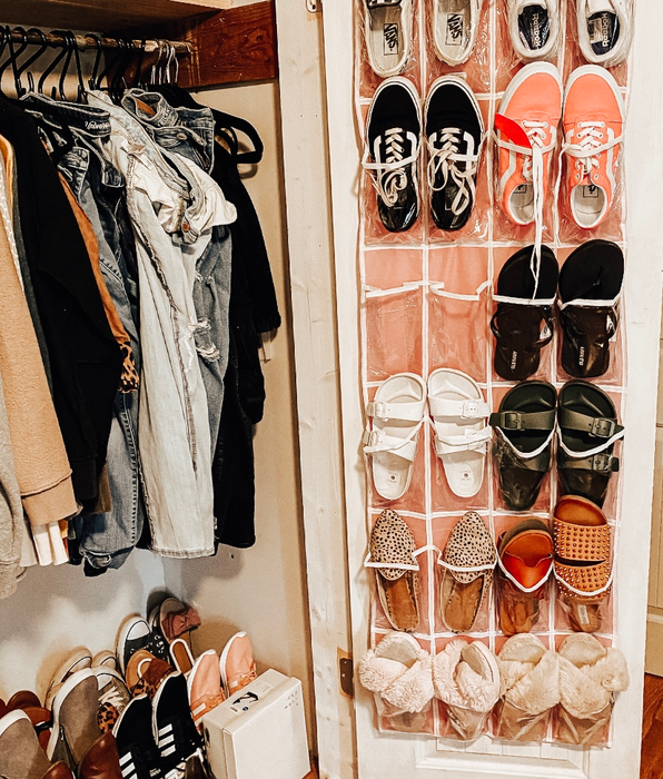 A reviewer's pink shoe holder filled with shoes, inside a closet.