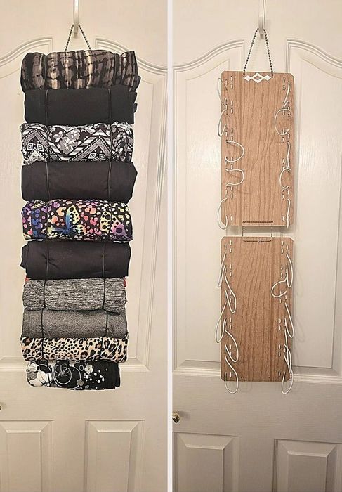 A hanging organizer, one section filled with neatly rolled T-shirts secured by elastic, and another empty space ready to use.