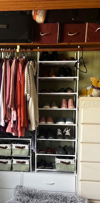 The shoe rack neatly arranged in a compact closet