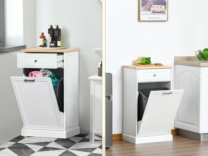 A wooden cabinet featuring a trash can and other items on top.