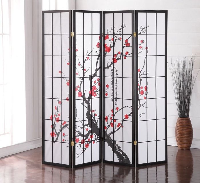 A room divider adorned with plum blossom designs