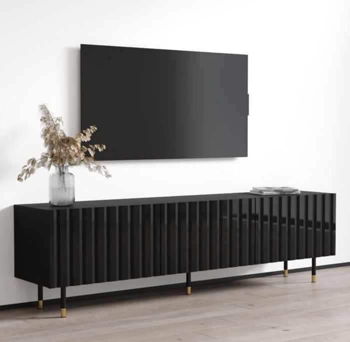 A sleek media console placed in a contemporary living room.