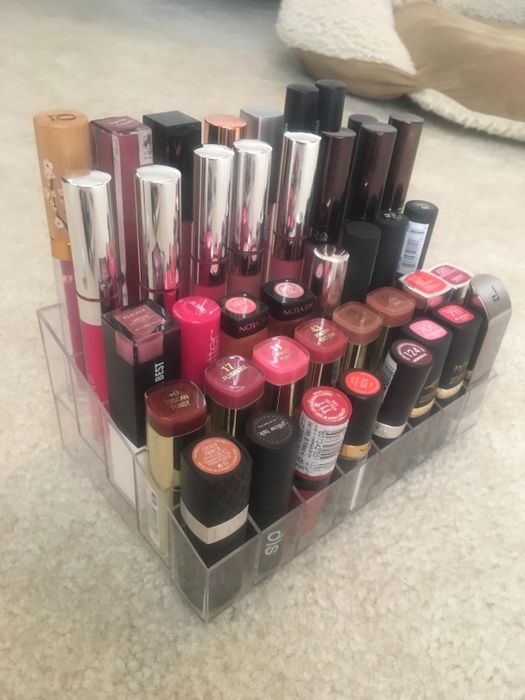 A reviewer’s photo showing their lipstick organizer filled with various lip products.