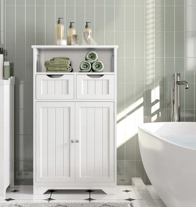A bathroom storage cabinet placed within a bathroom, adding both function and style.