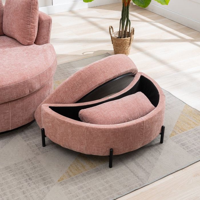 A stylish pink storage ottoman, shown open to reveal its interior, placed in a comfortable living room environment
