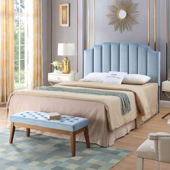 the headboard in a soft powder blue shade