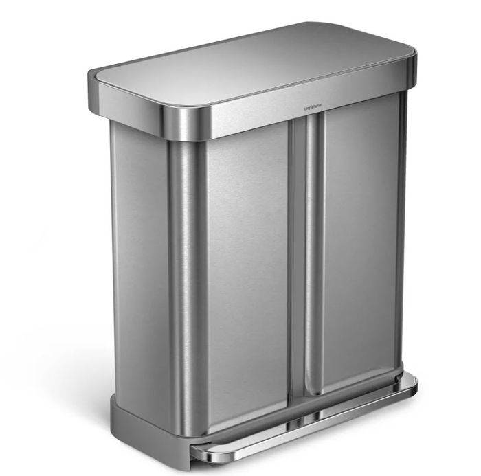 A sleek stainless steel dual-compartment step trash can with the lid securely closed.